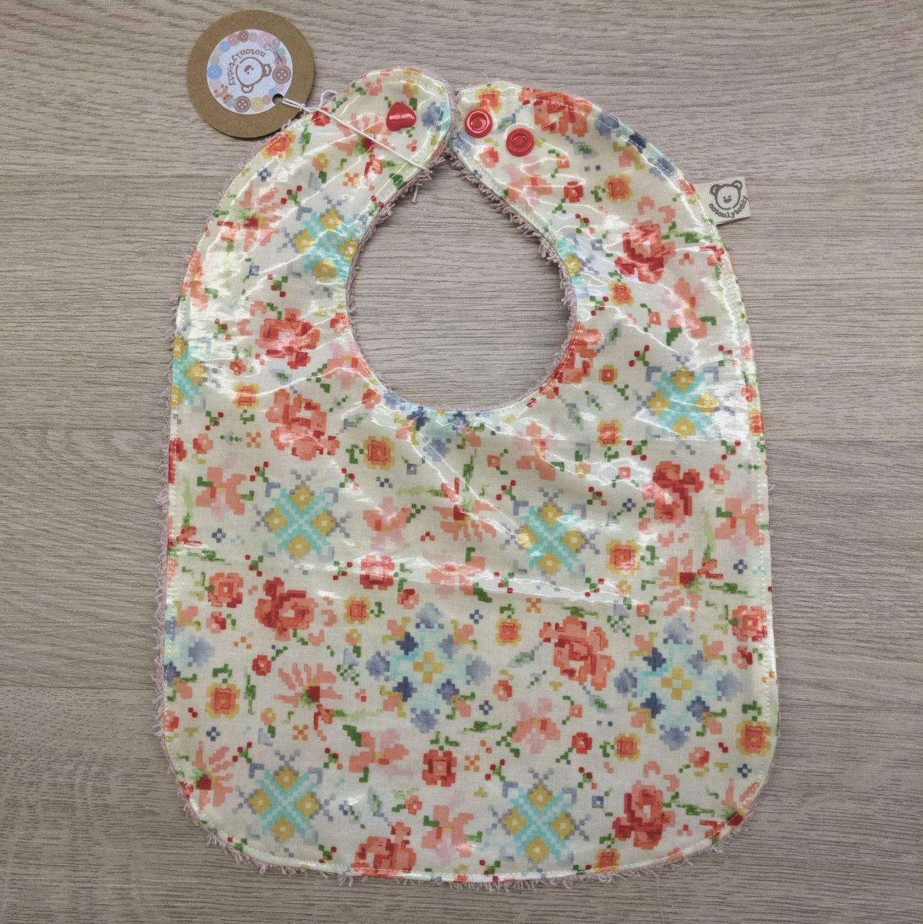 Bavaglino cerato con grafica a fiori pixelati - retro in spugna