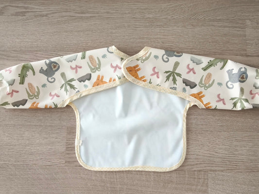 Bavaglino cerato con maniche - fantasia con animali