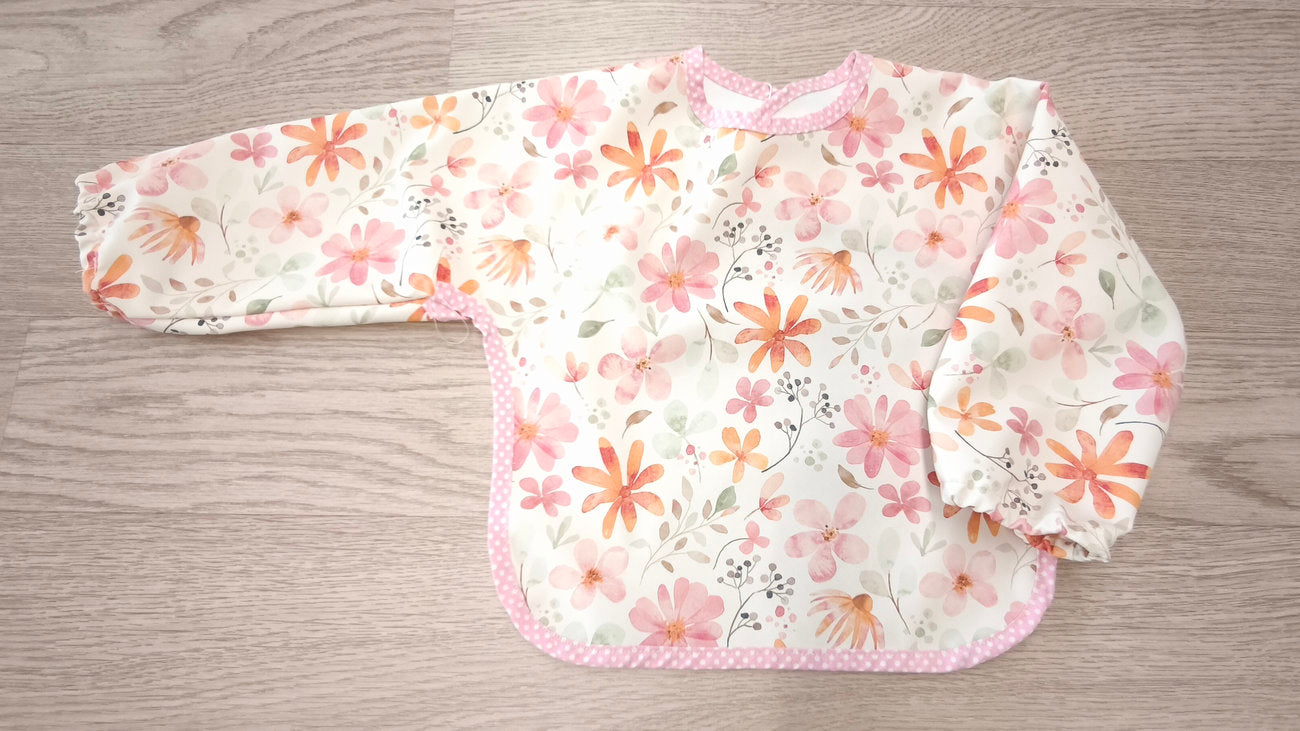 Bavaglino cerato con maniche - fantasia fiori