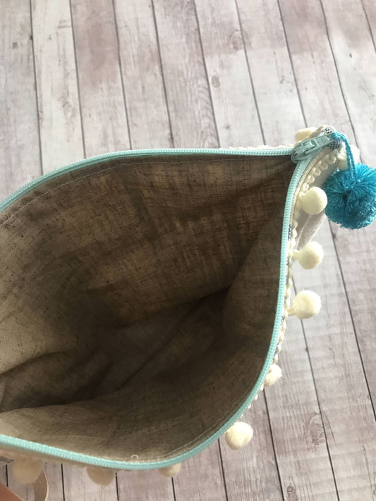 Busta mare a righe con pompon e manichetto con cabina