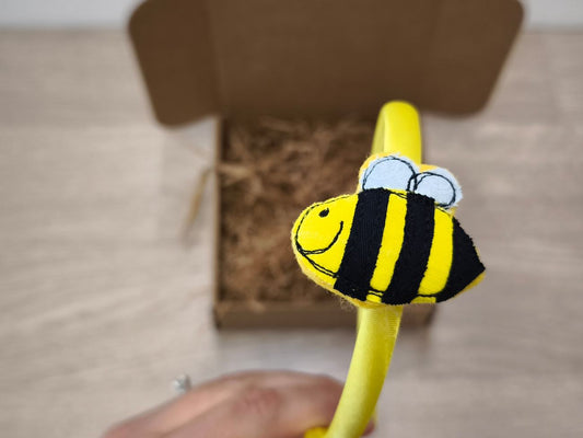 Cerchietto in raso giallo con apetta