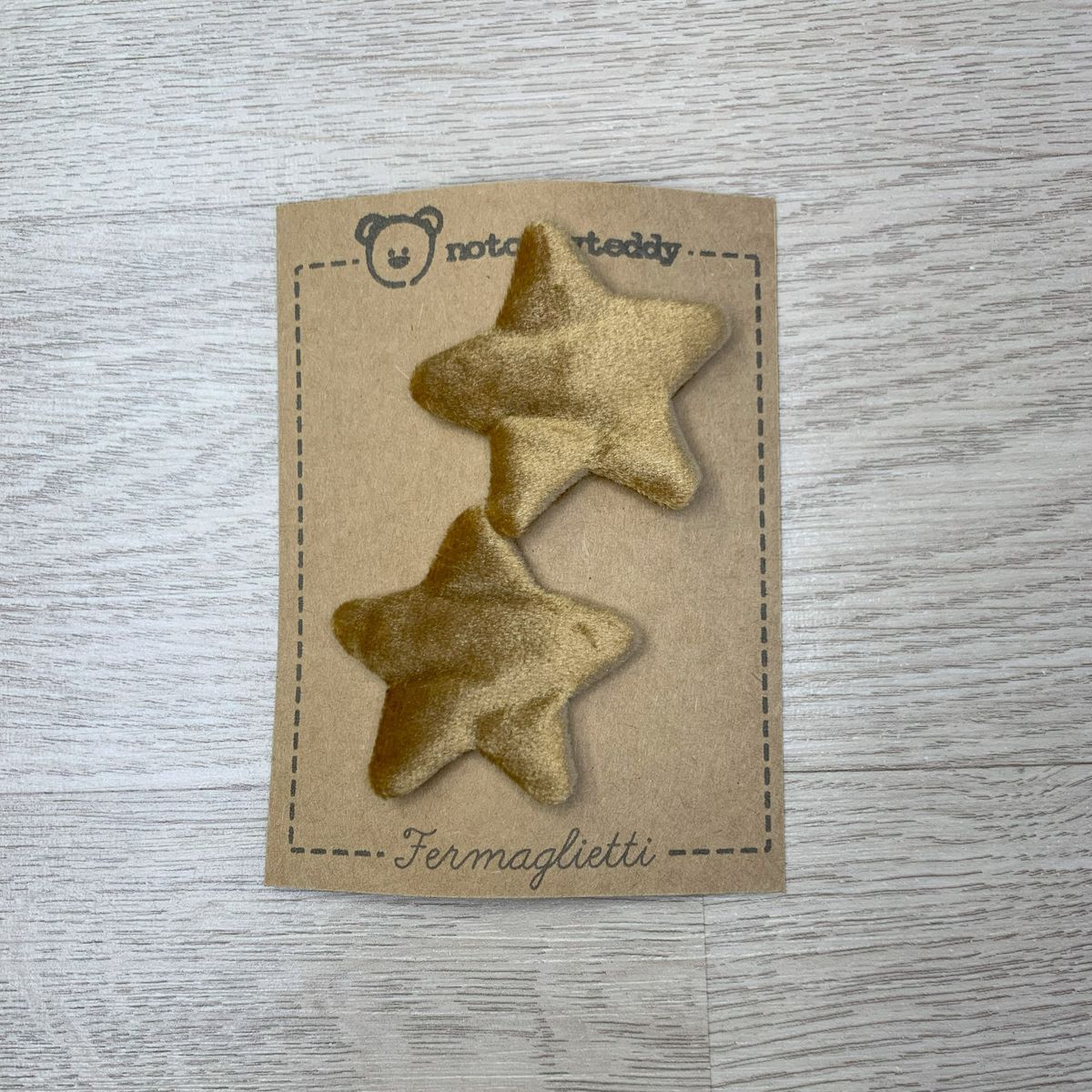 fermaglietti piccoli a forma di stellina in velluto bronzo