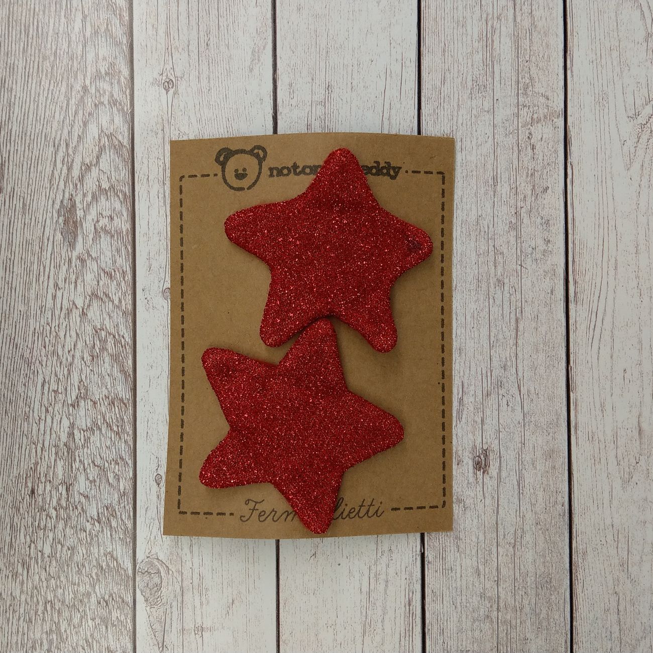 fermaglietti a forma di stellina in maglina glitter rosso