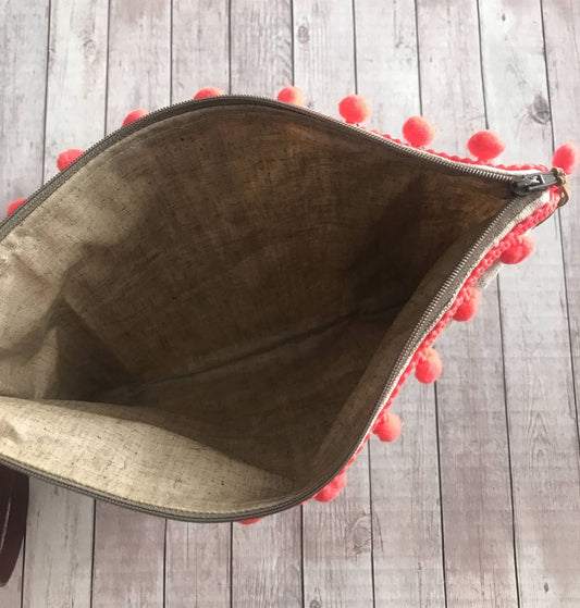 Busta mare a righe con pompon e manichetto con occhiali