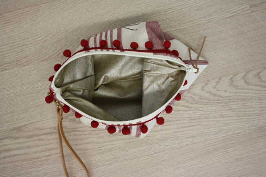 Busta mare a righe con pompon e manichetto con faro