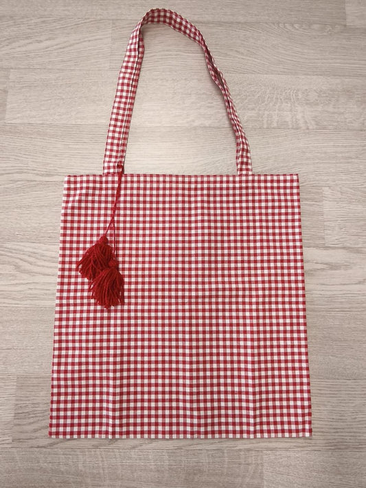 shopper a quadretti rossi con nappine rosse