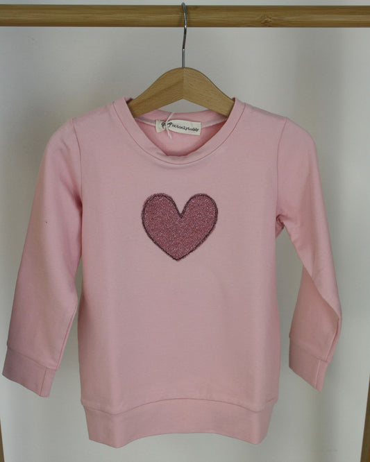 Felpa garzata rosa con stella in maglina glitter rosa