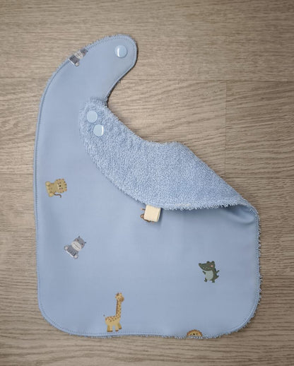 Bavaglino cerato azzurro con animaletti baby - retro in spugna azzurra