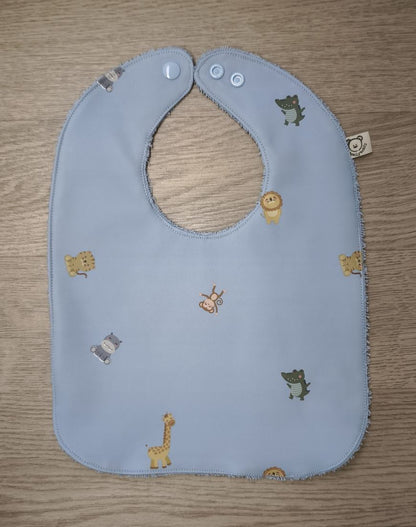 Bavaglino cerato azzurro con animaletti baby - retro in spugna azzurra