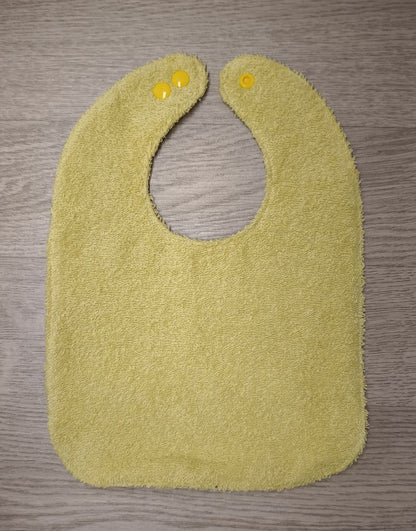 Bavaglino cerato con fiorellini piccoli - retro in spugna gialla