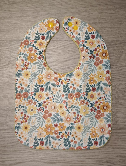 Bavaglino cerato con fiorellini piccoli - retro in spugna gialla