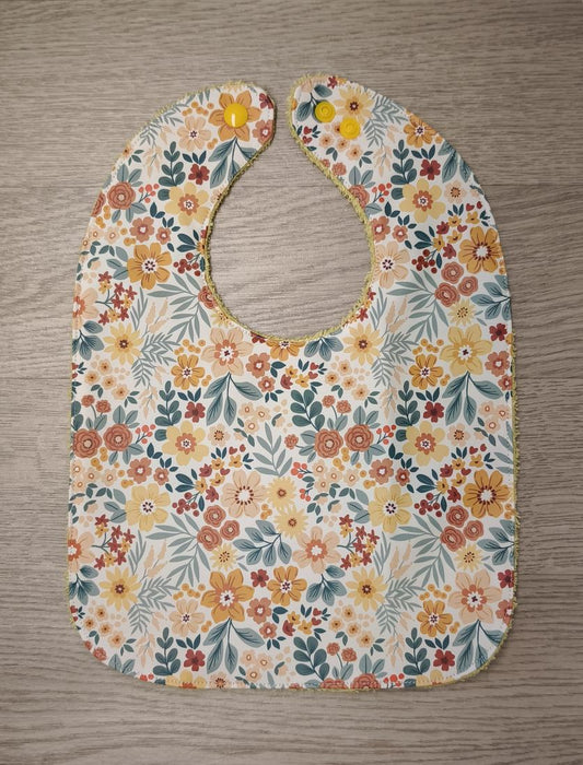 Bavaglino cerato con fiorellini piccoli - retro in spugna gialla