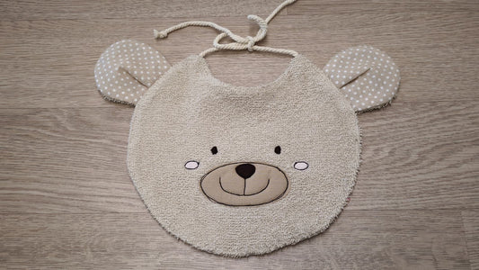 bavaglino a forma di musetto di orso beige