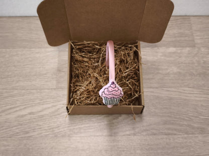 Cerchietto in raso rosa con cupcake
