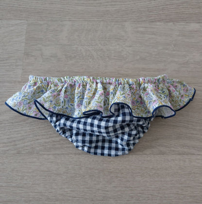 Retro di costumino bambina con volant quadretti blu e fiorellini