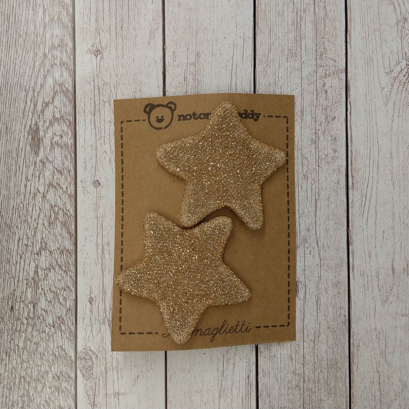 fermaglietti a forma di stella in maglina glitter oro