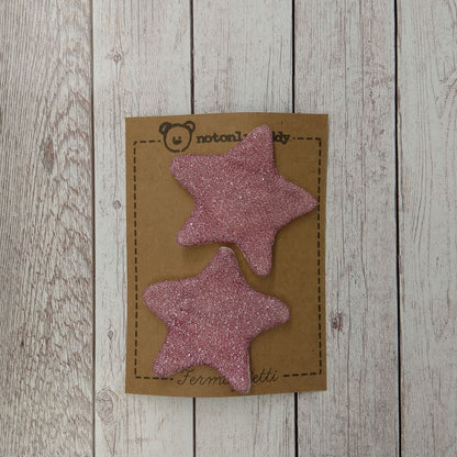 fermaglietti a forma di stella in maglina glitter rosa