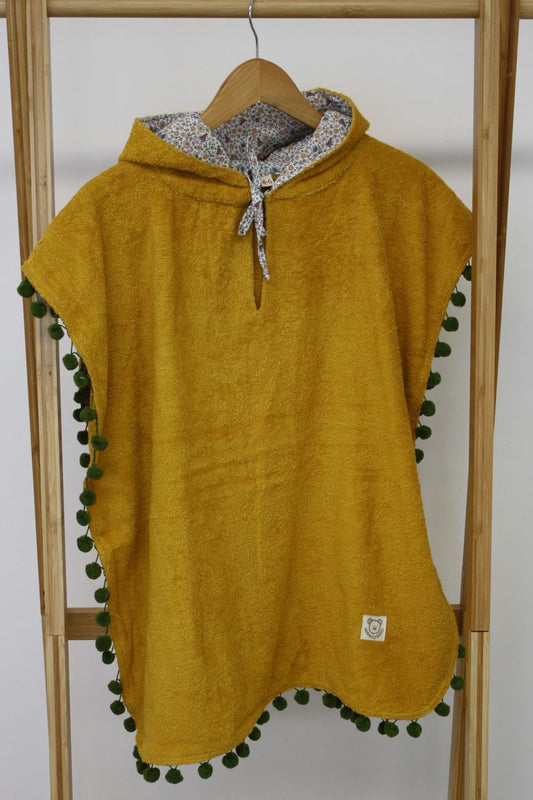 poncho bambina per la spiaggia, spugna senape e tessuto a fiori