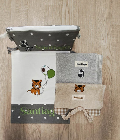Sacchetto semplice bianco e grigio a pois con decorazione di tigrotto
