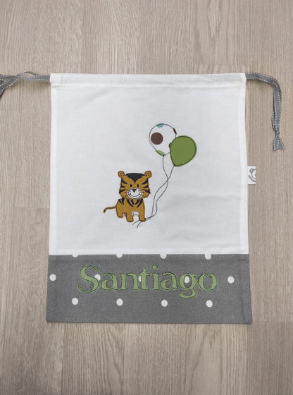 Sacchetto semplice bianco e grigio a pois con decorazione di tigrotto