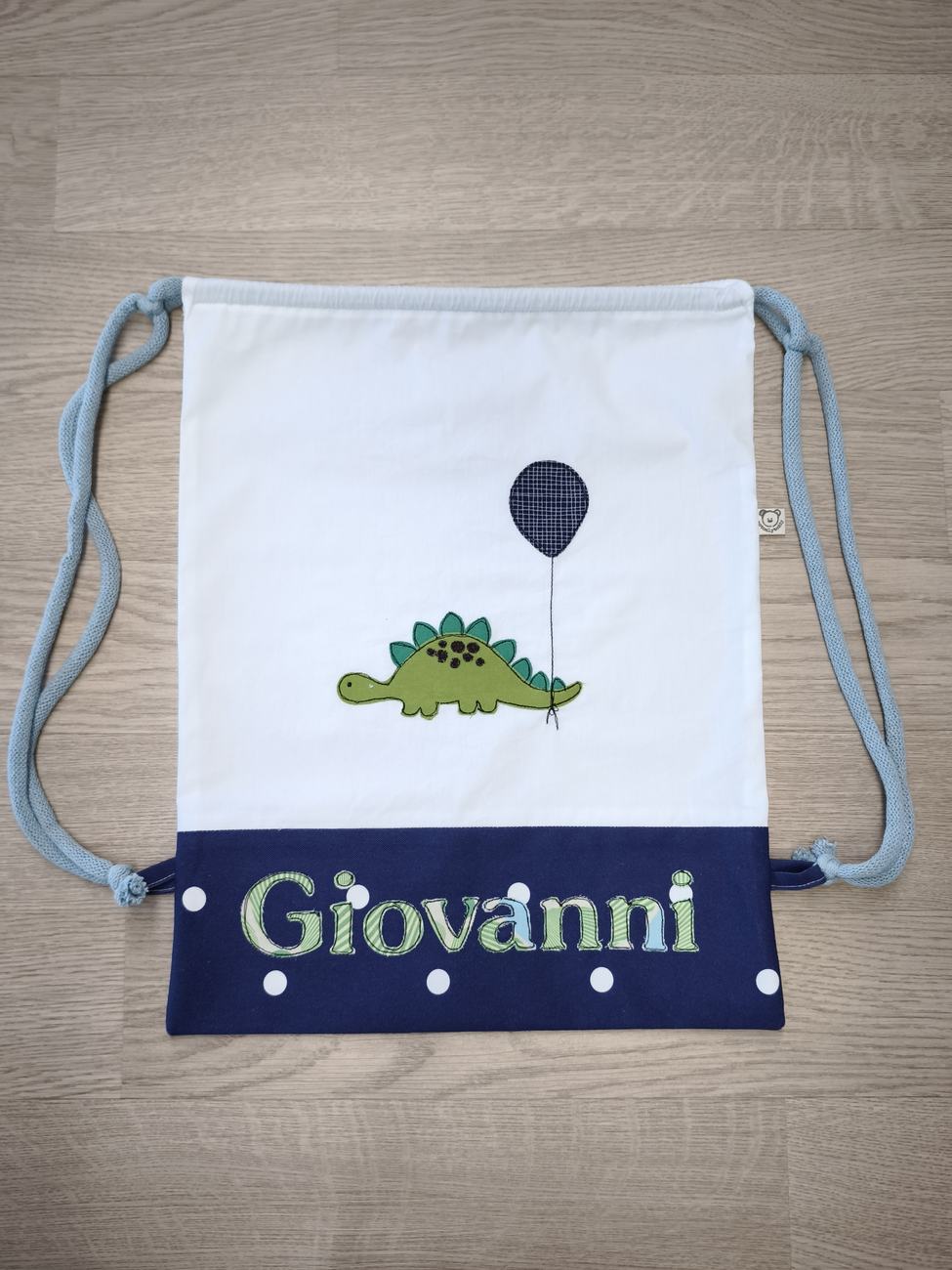 zainetto per asilo con decorazione di dinosauro con palloncino